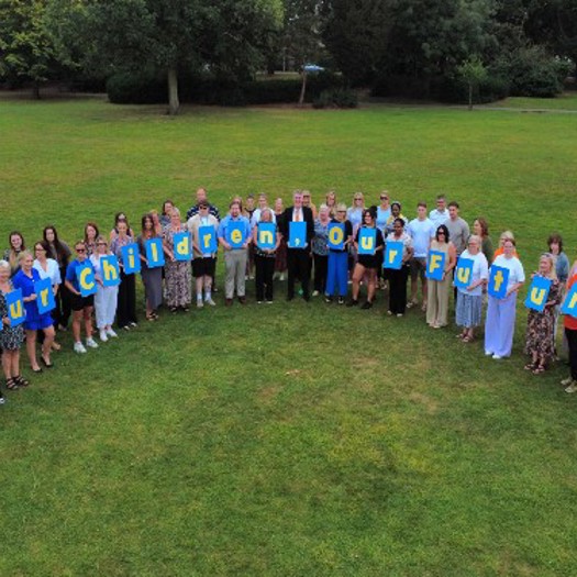 Photo by North East Lincolnshire|Photo by gstockstudio/AdobeStock|North East Lincolnshire DCS Ann-Marie Matson |Social worker talking to teenage girl while they sitting on sofa in the living room with foster parents