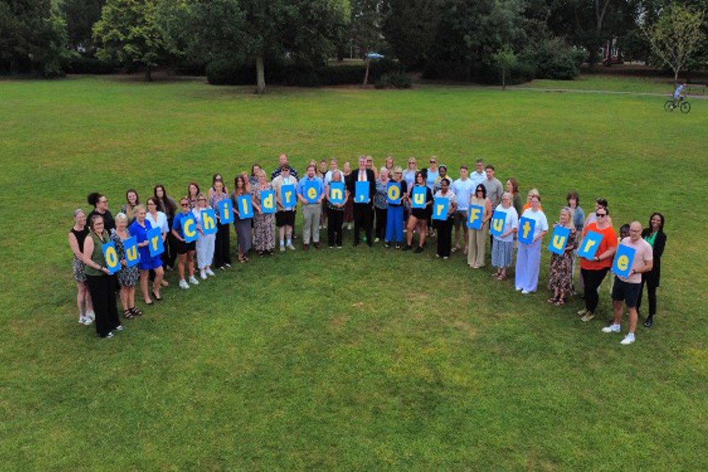 Photo by North East Lincolnshire|Photo by gstockstudio/AdobeStock|North East Lincolnshire DCS Ann-Marie Matson |Social worker talking to teenage girl while they sitting on sofa in the living room with foster parents