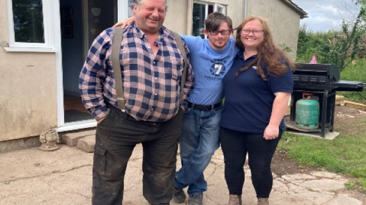 Paul is flanked by Shared Lives carers Maurice (left) and Simone (right) (credit: Herefordshire Council)