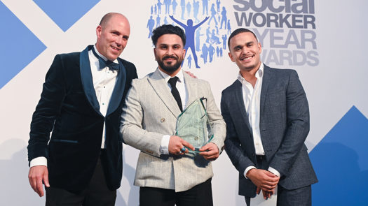 (L-R) Headline sponsor Sanctuary Personnel's CEO, James Rook, overall winner Omaid Badar, and broadcaster and journalist Ashley John-Baptiste (credit: Social Work Awards)