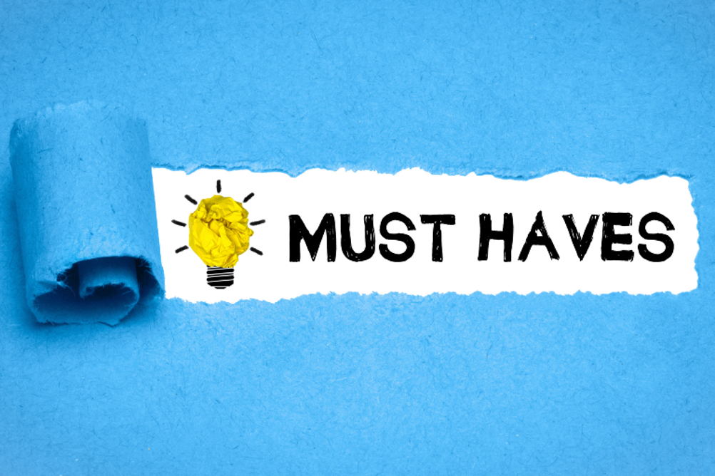 The words 'must haves' against a blue background 