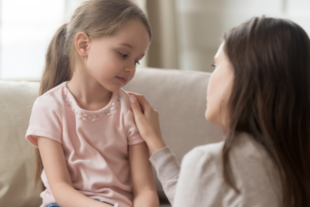 A mother comforting her daughter